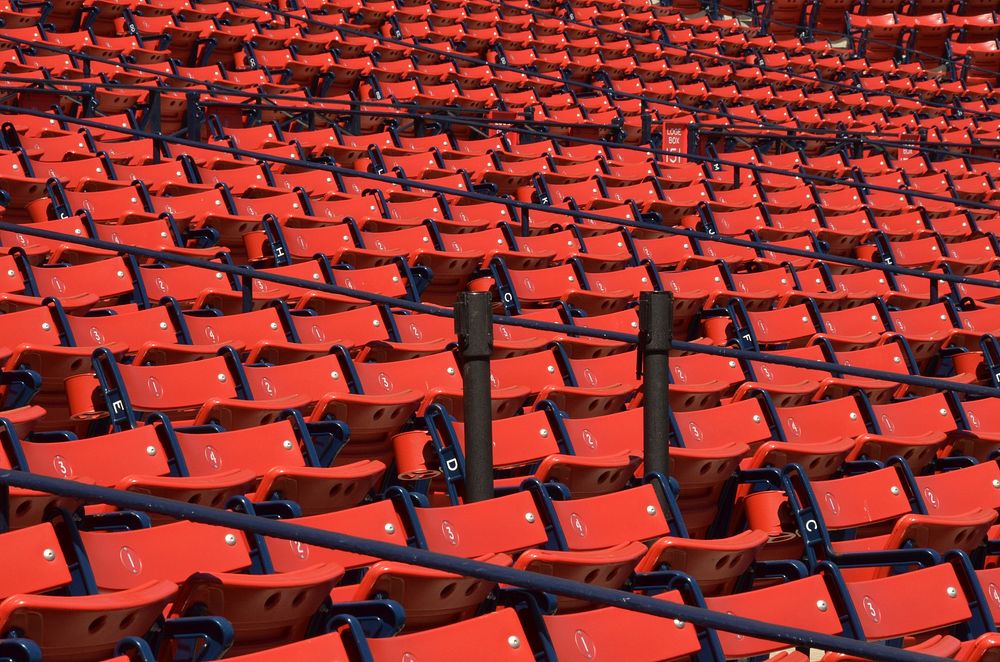 Closeup on red stadium seats. Free public domain CC0 image.