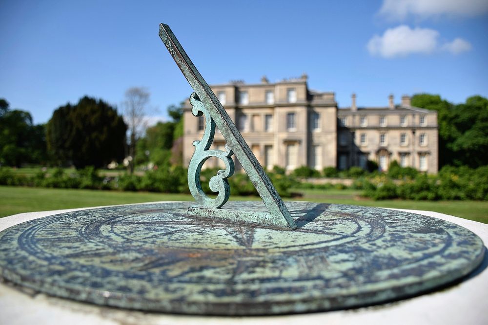 Sundial device, telling time by the sun. Free public domain CC0 photo.