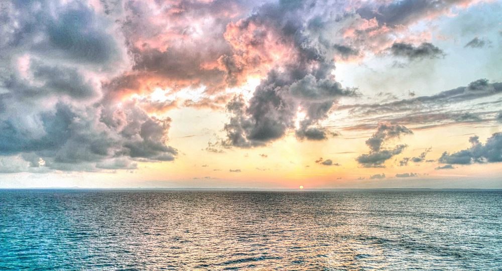 Beautiful sunset seascape scenery. Free public domain CC0 image.
