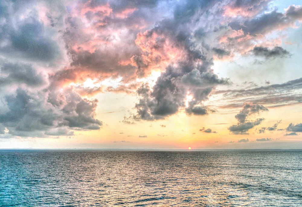 Beautiful sunset seascape scenery. Free public domain CC0 image.