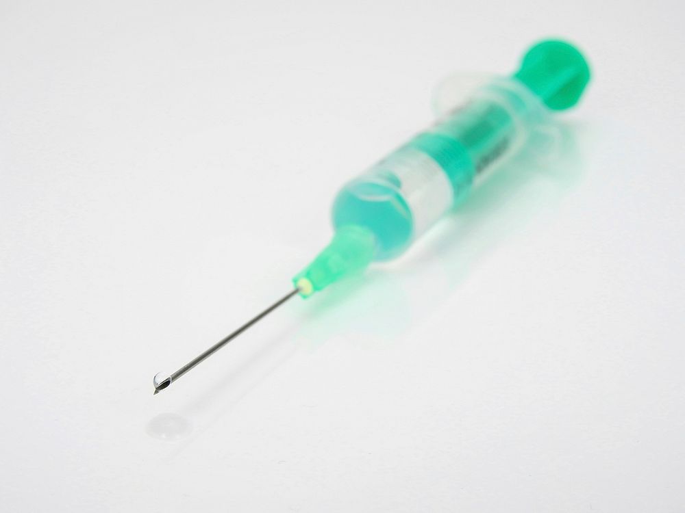 Vaccine injection, healthcare photo. Free public domain CC0 image.