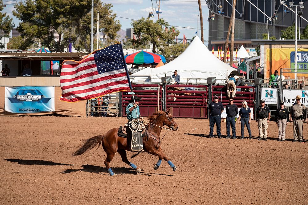 Flag bearer in Phoenix at the All-Indian Rodeo, a featured competition, open only to Native Americans with proof of tribal…