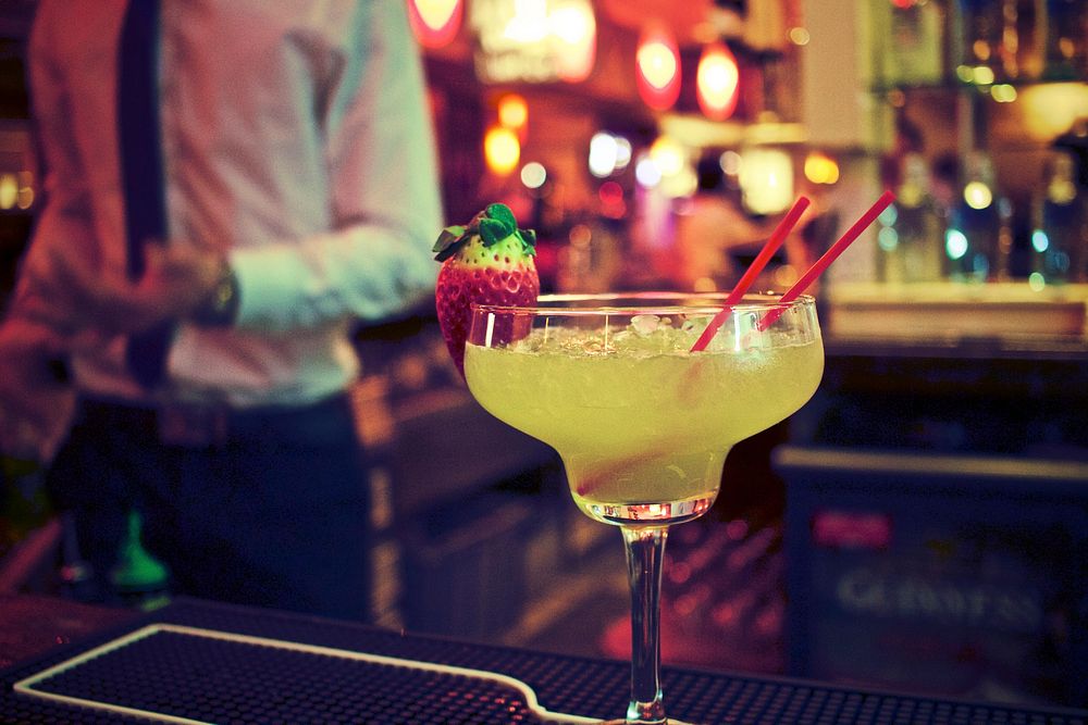 Free yellow cocktail, bar background photo, public domain beverage CC0 image.