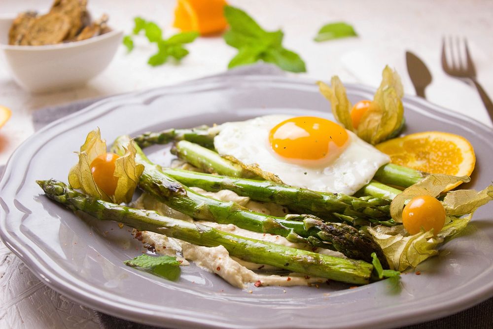 Free asparagus, fried eggs, dish in white plate photo, public domain food CC0 image.