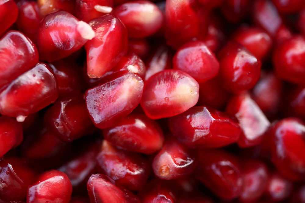 Free close up pomegranate seed background image, public domain fruit CC0 photo.