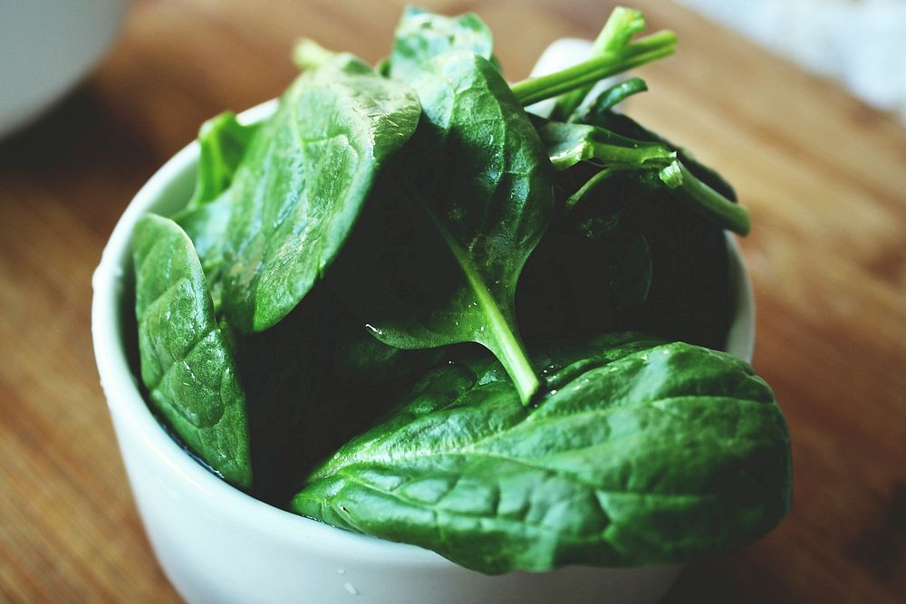 Free green spinach in bowl photo, public domain vegetables CC0 image.