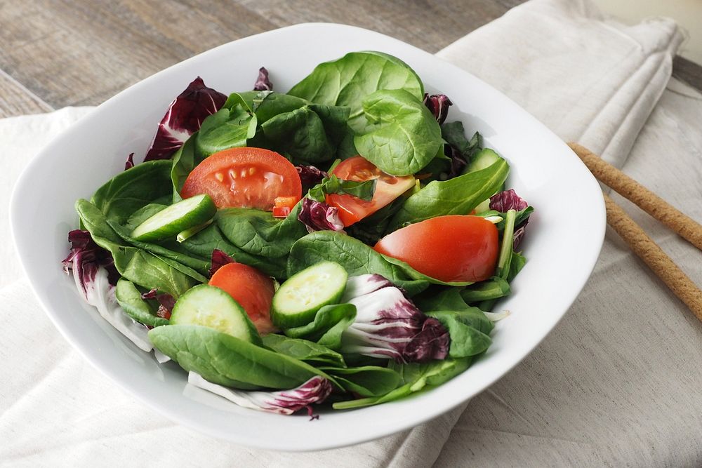 Healthy vegetable salad in plate, free public domain CC0 photo.