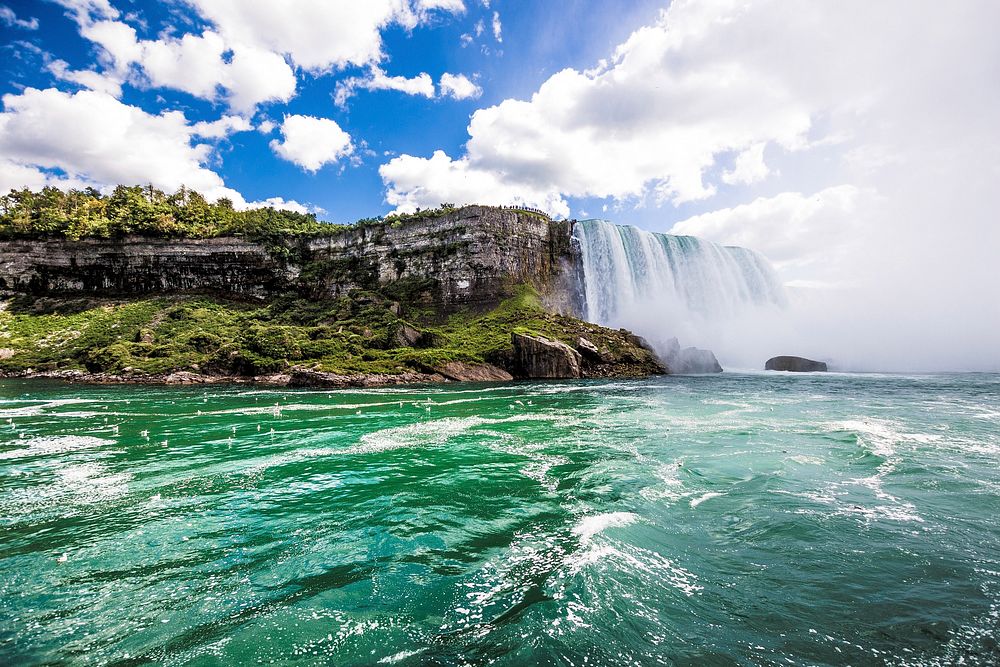 Niagara falls under blue sky, free public domain CC0 photo.
