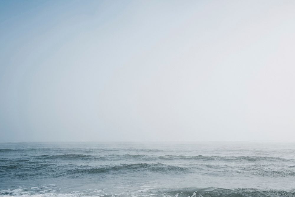 Misty ocean, rippled, tide, grey sky, free public domain CC0 photo.