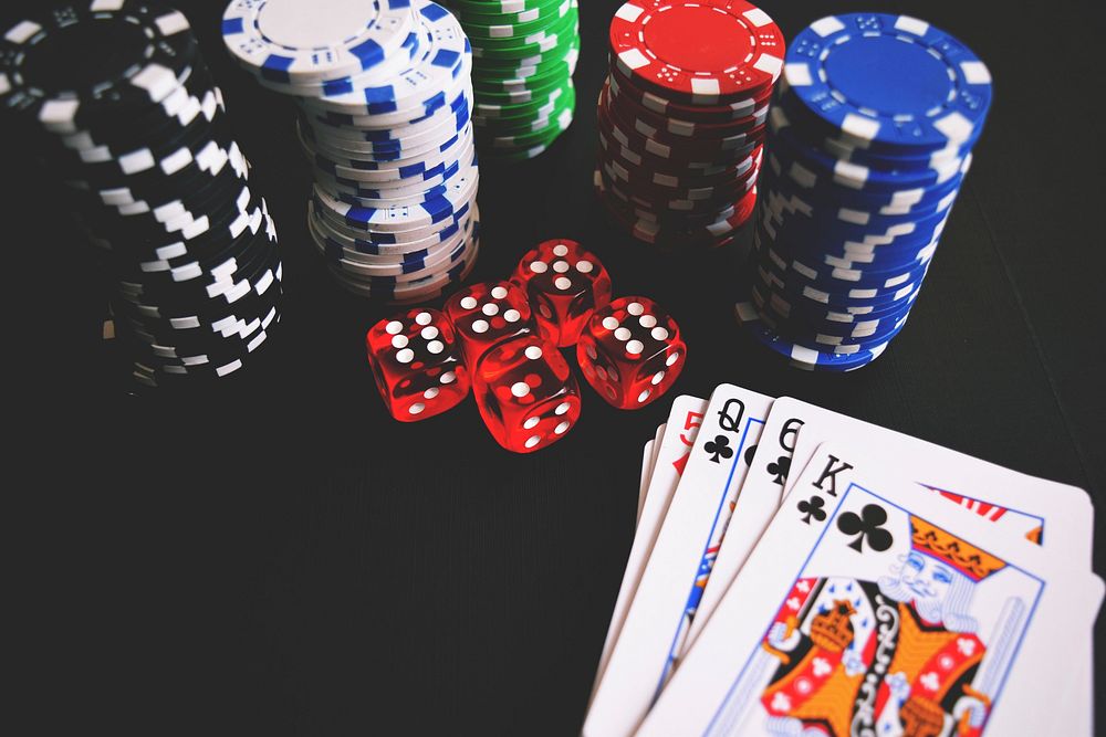 Casino chips, cards and dice on the table, free public domain CC0 photo.