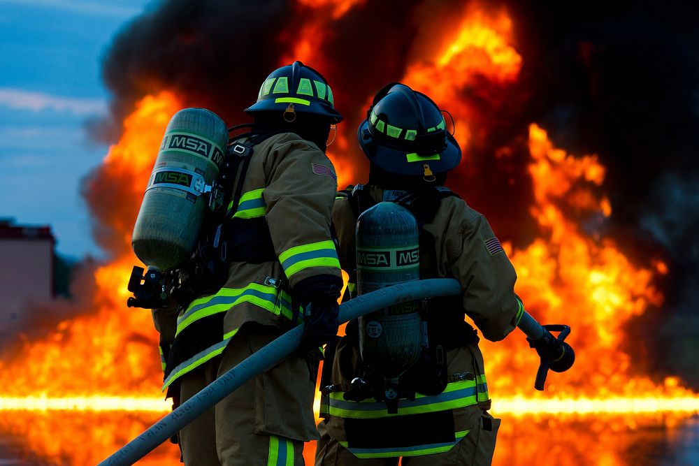 Free firefighters putting out fire photo, public domain CC0 image.