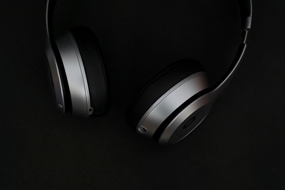 Free headphones on black image, public domain CC0 photo.