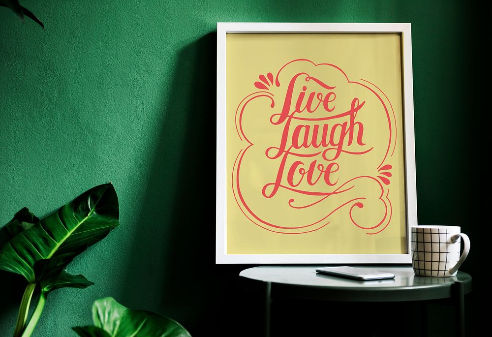 A motivation typography print on the desk against the green wall