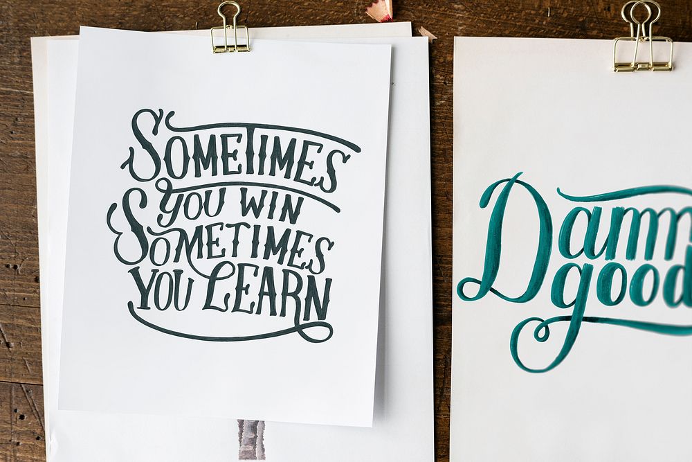 Hand lettering of motivation quote on sketch sheets