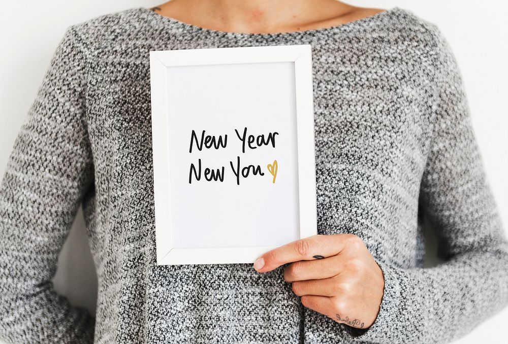 Woman holding a New Year New You Card