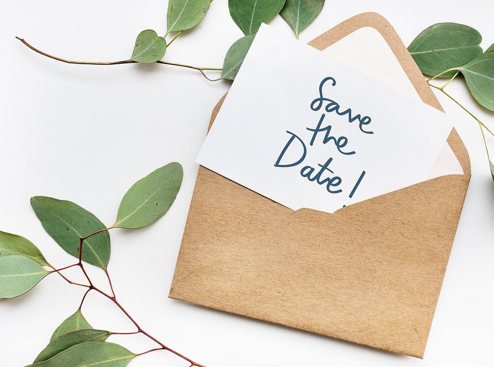 Card in an envelope mockup with leaves in the background
