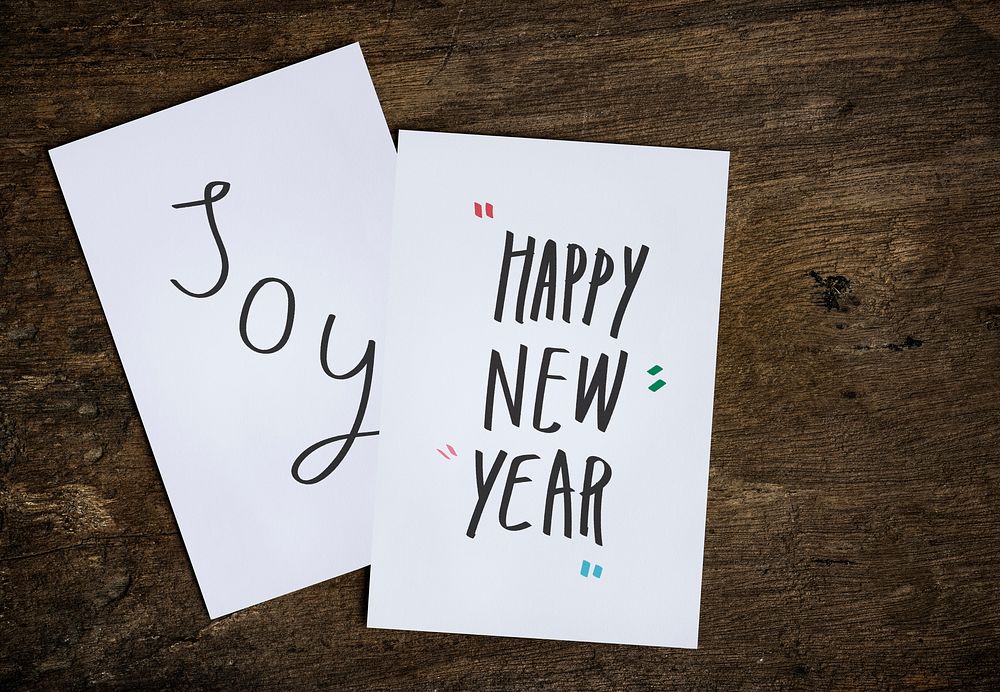 New Year wishing card on a wooden table