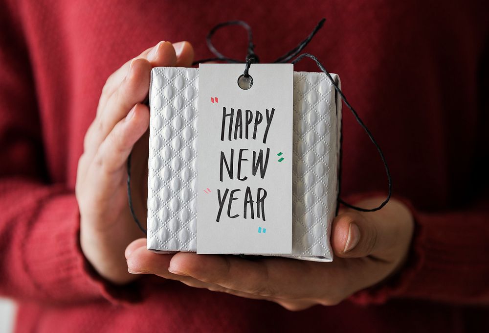 Woman holding Happy New Year present