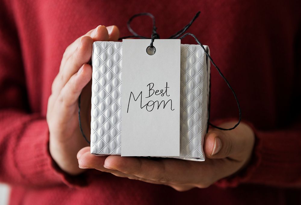 Woman holding present for her mom
