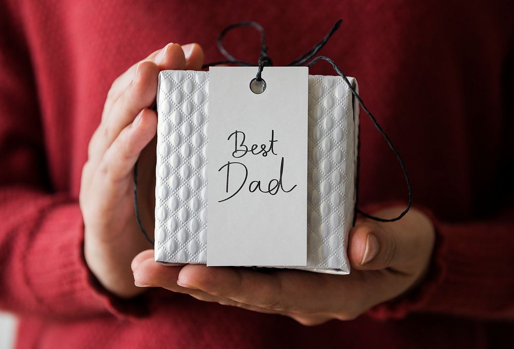 Woman holding present for her dad