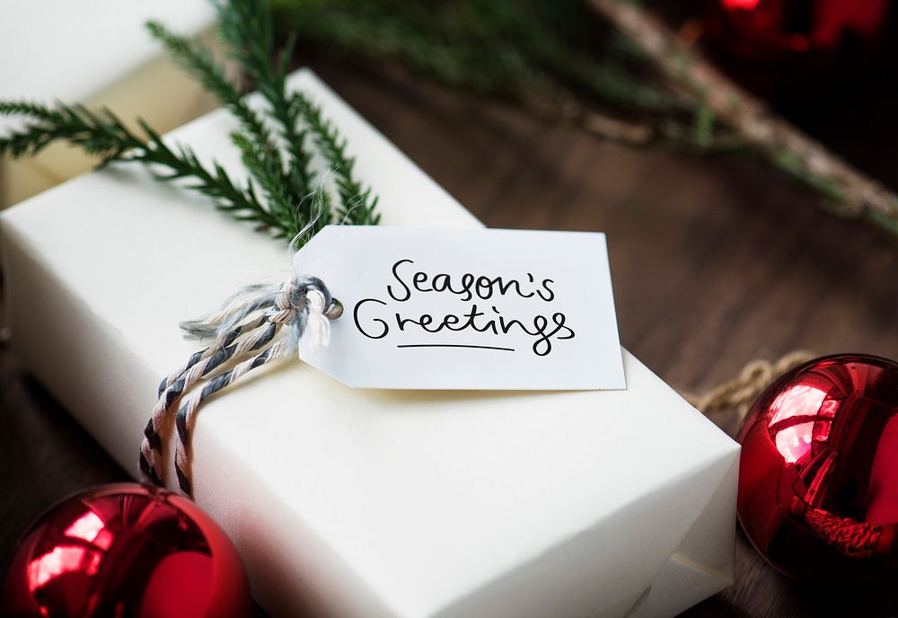 Season's Greeting tag on a gift box