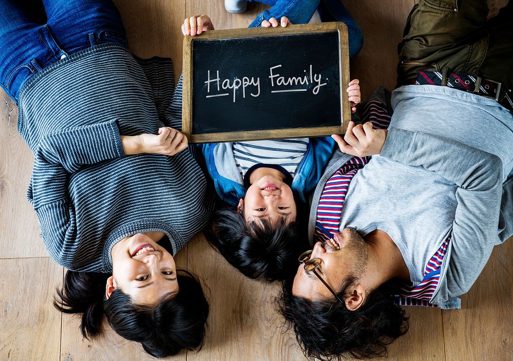 Family holding a phrase Happy Family
