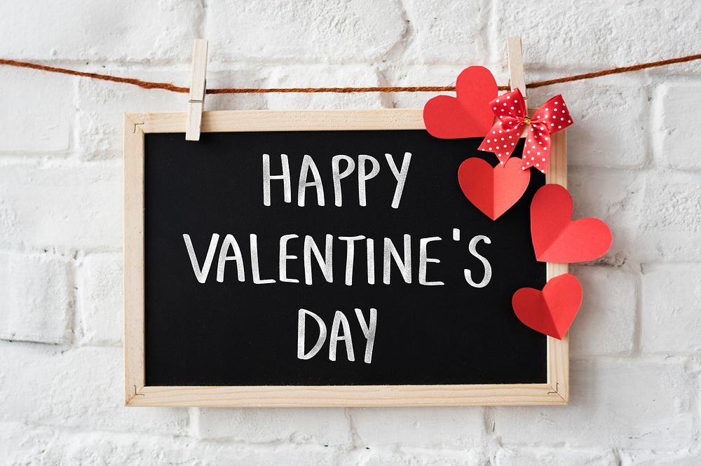 Text Happy Valentine's Day written on a blackboard