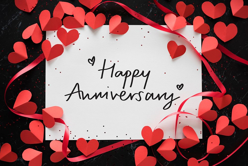 Happy Anniversary card decorated with heart shapes