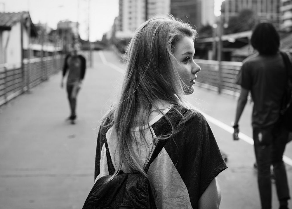 A young woman wandering on the street