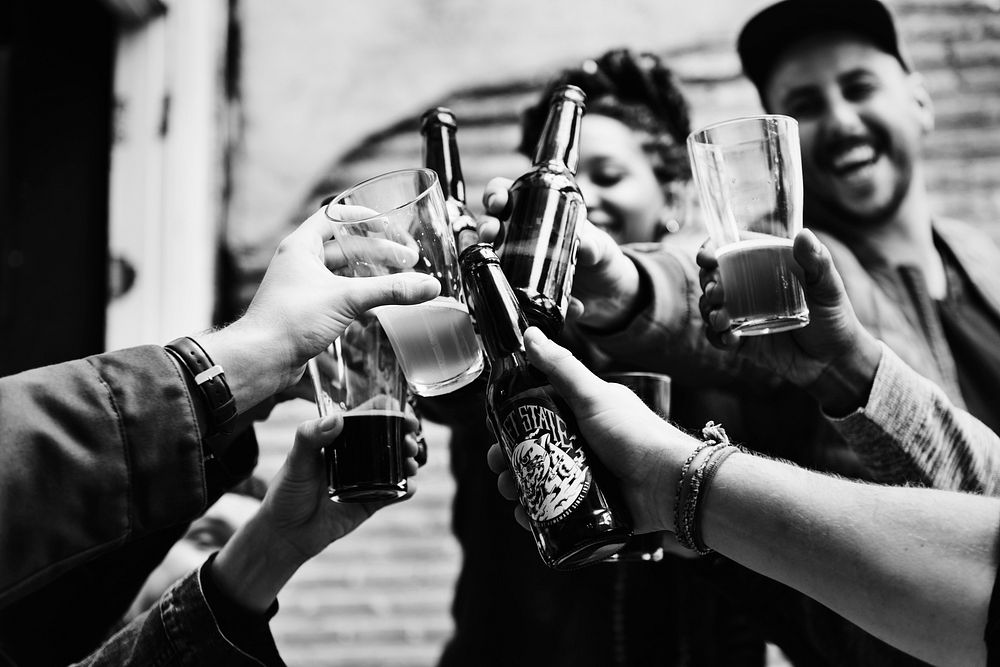 People making a toast with beers