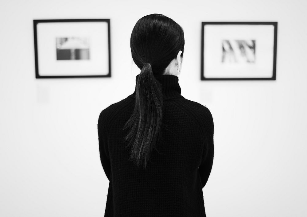 Woman looking at an art exhibition