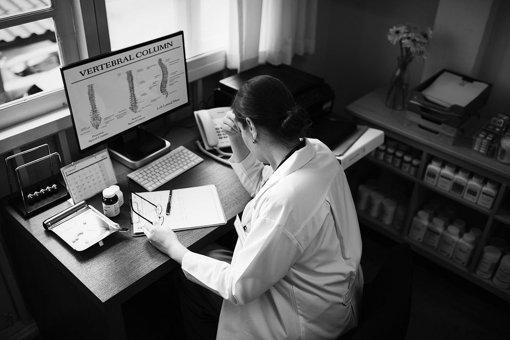 Female doctor studying a case