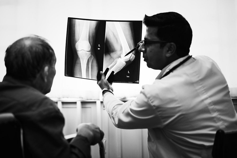 Doctor with a patient's x-ray film