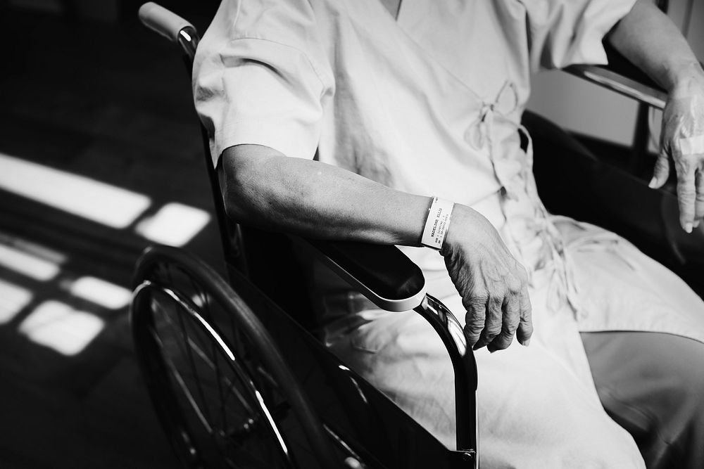 An old patient sitting in a wheelchair