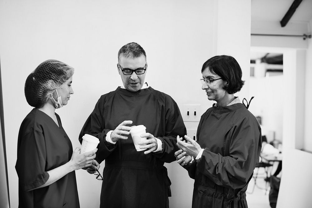 Doctors talking together during break time