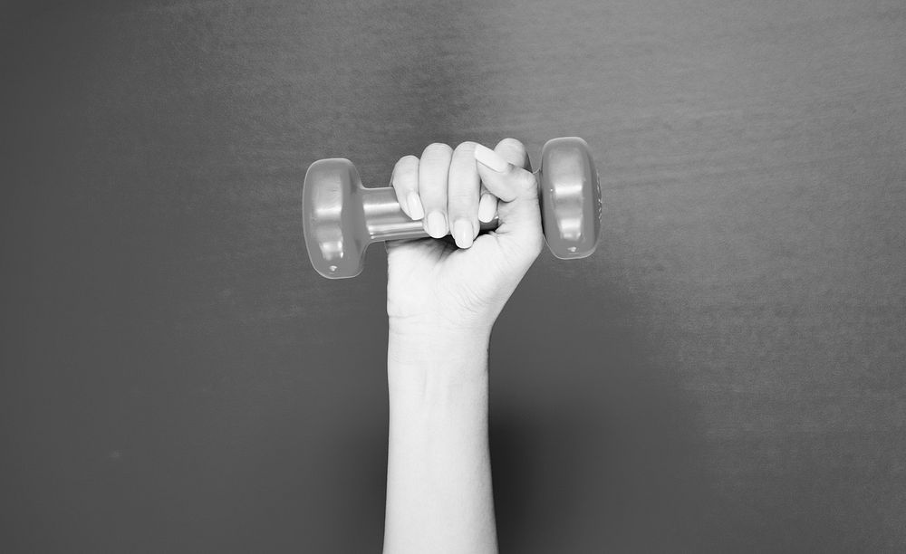 Closeup of hand holding a dumbbell