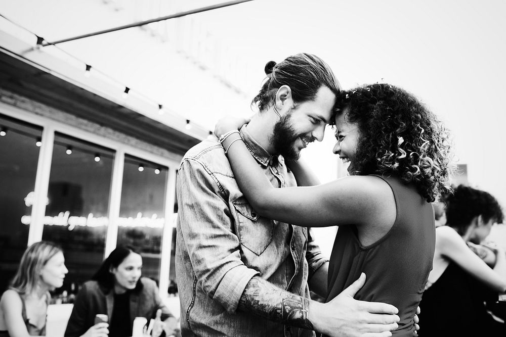 Couple dancing together at a birthday party