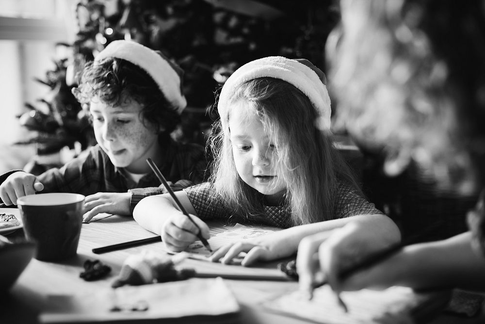 Kids enjoying a coloring book at a Christmas party