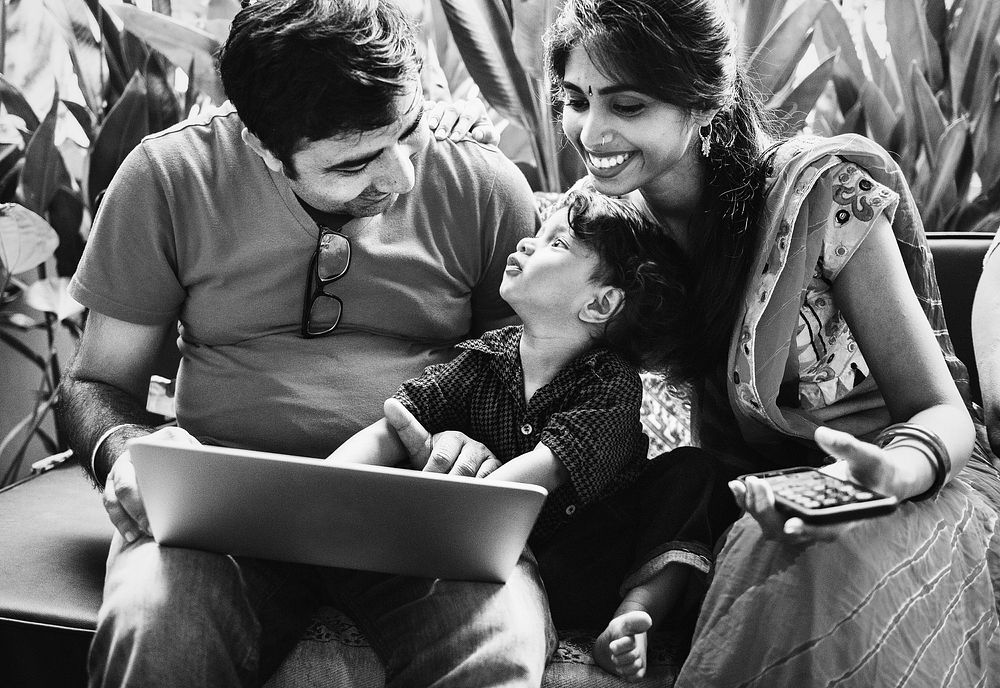 Indian family using a laptop together