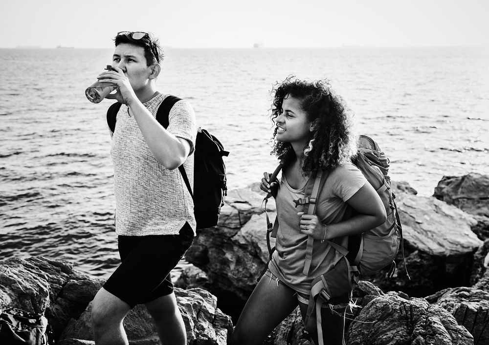 Young couple traveling together by the sea