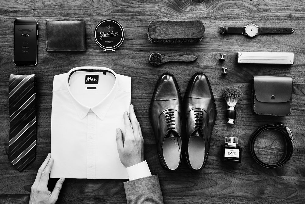 Flat lay of businessman arranging his belongings