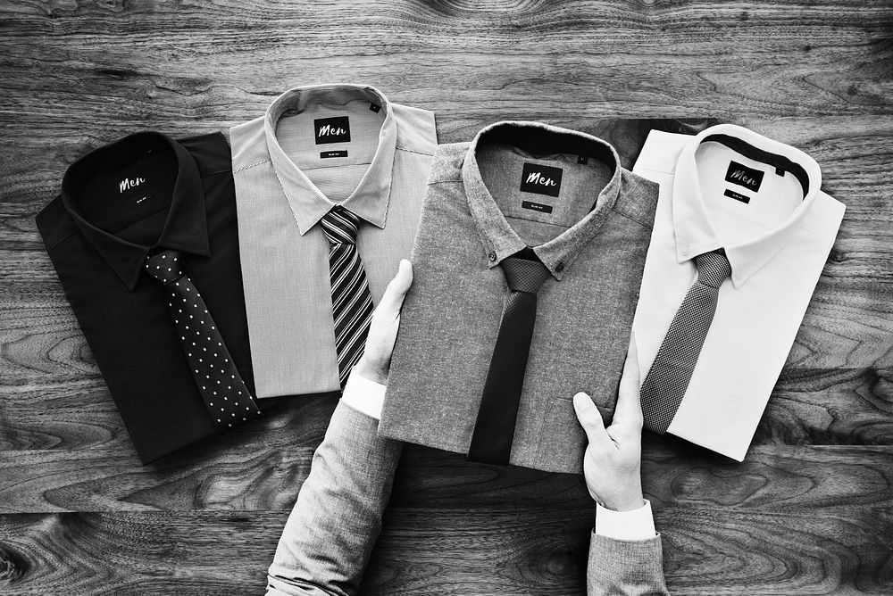 Businessman selecting shirts to wear