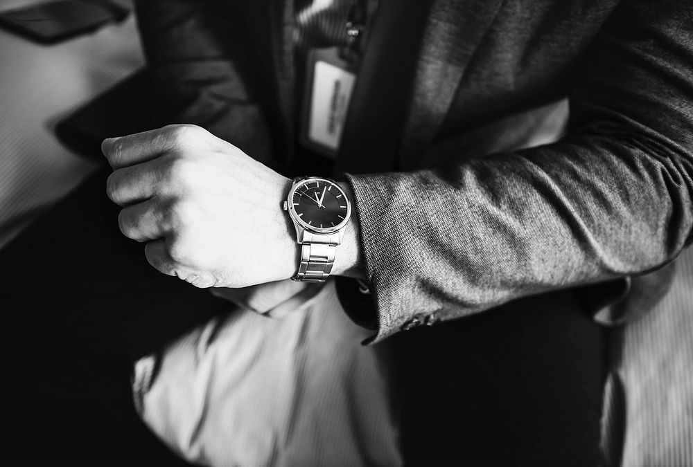A man putting on a watch