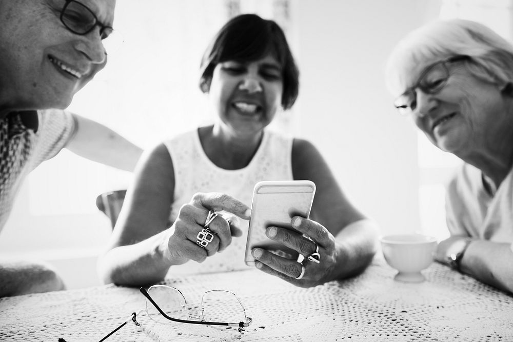 Group of diverse senior people using mobile phones