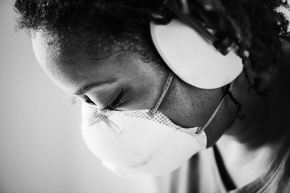 African woman wearing ear protection