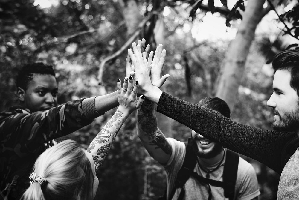 Friends trekking in a forest