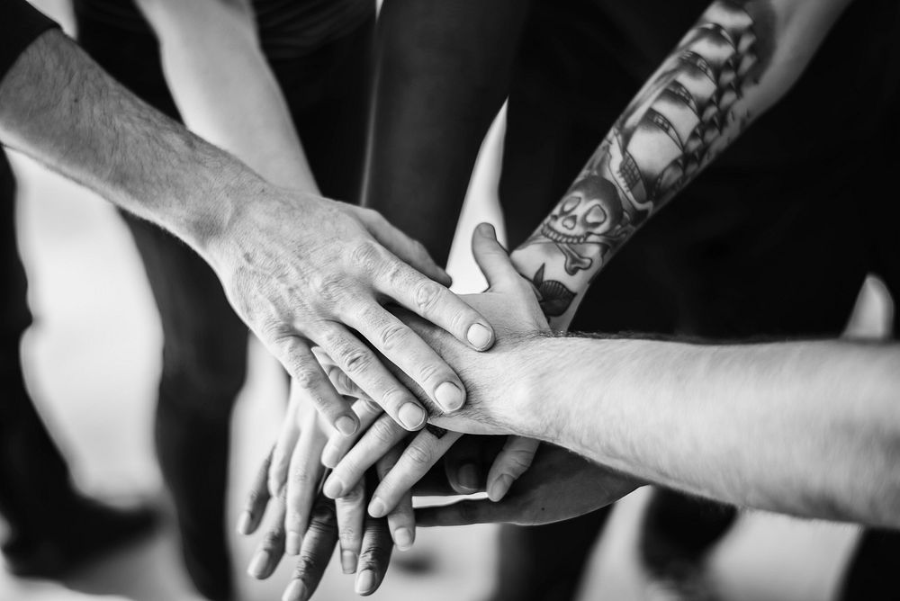 People joining hands together as a team