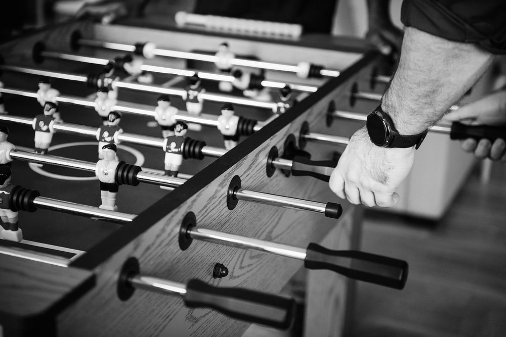People playing table football together