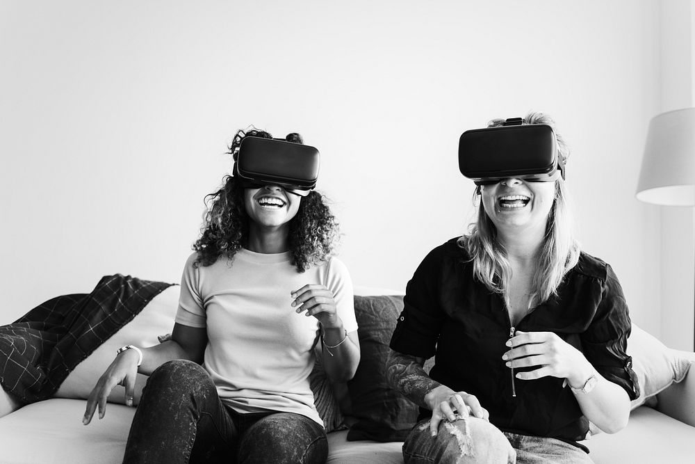 Women experiencing virtual reality with VR headset