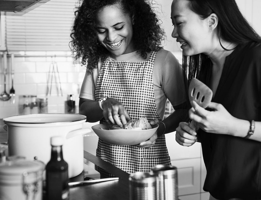 Diverse women cooking in the kitchen